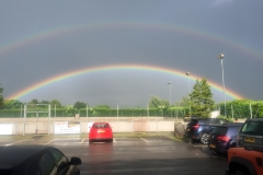 A stunning double rainbow frames the outdoor pitch at DASC, Disley